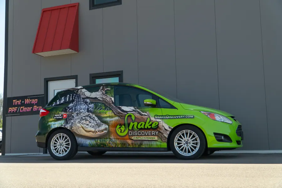 Ford Focus, commercial wrap for Rex by Tint & Wrap MN in Prior Lake, MN, photo 1 of 25