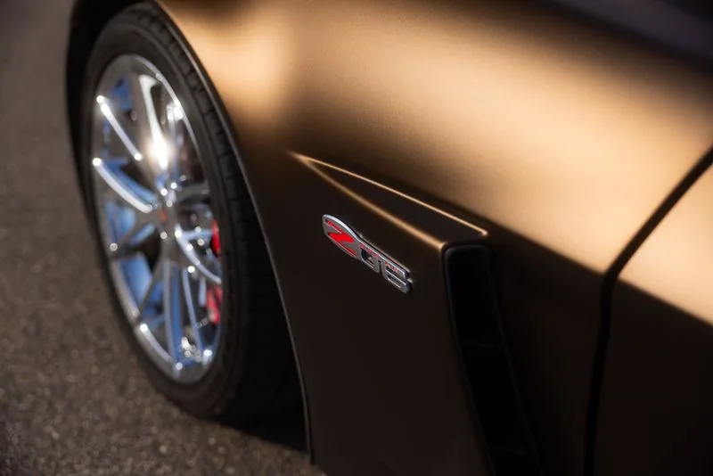 Chrome wheel on a matte brown car