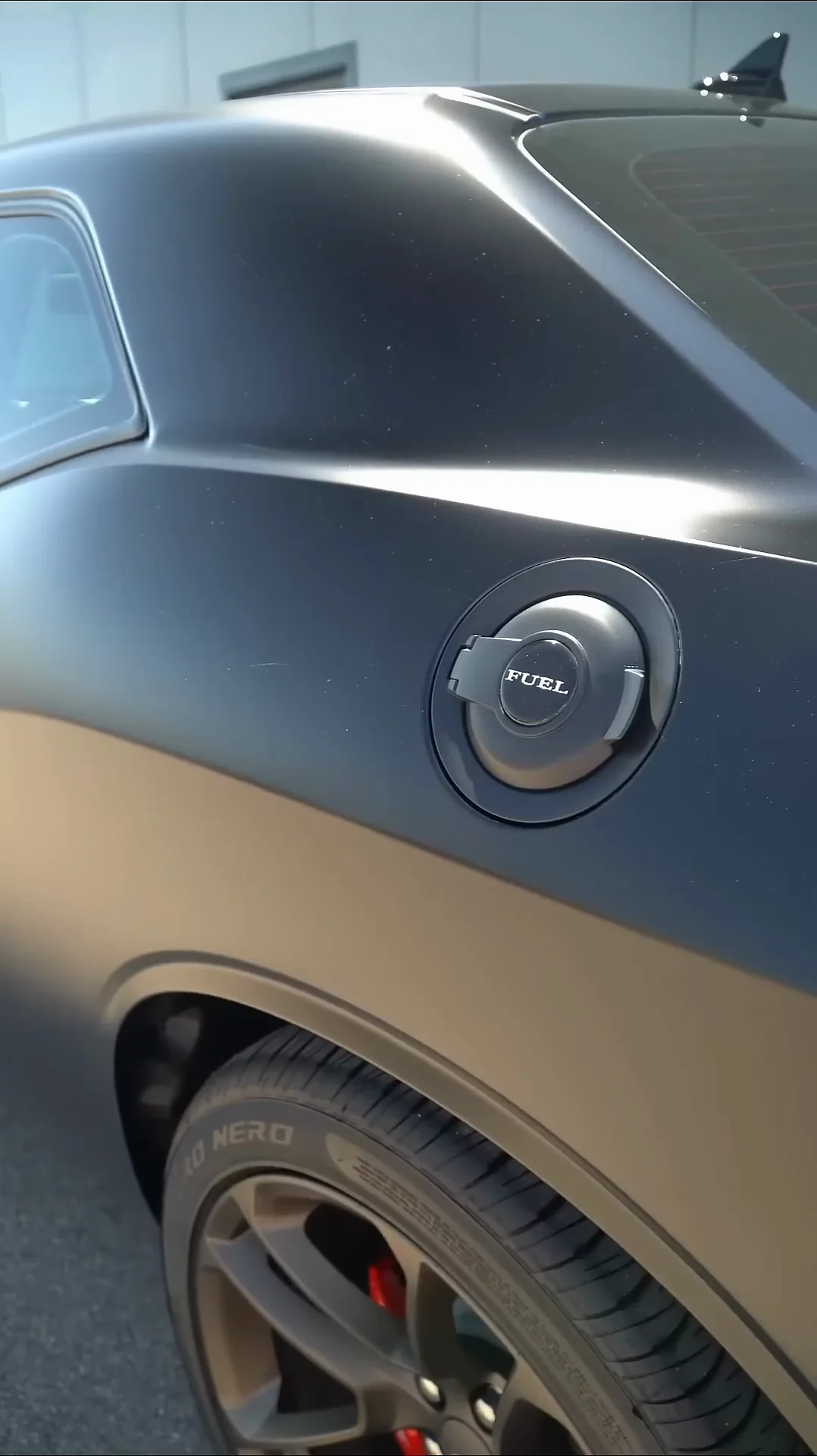 Side of a Dodge Challenger in a matte wrap